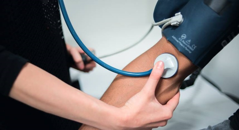 GP performing a blood pressure check