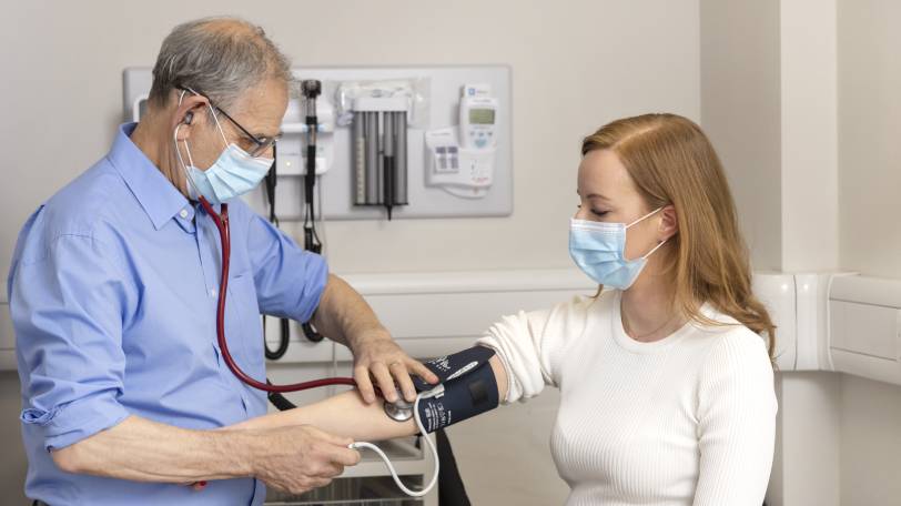 Dr David Myers with a patient